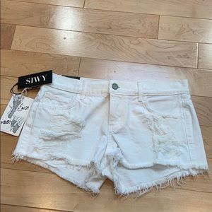 White distressed denim shorts
